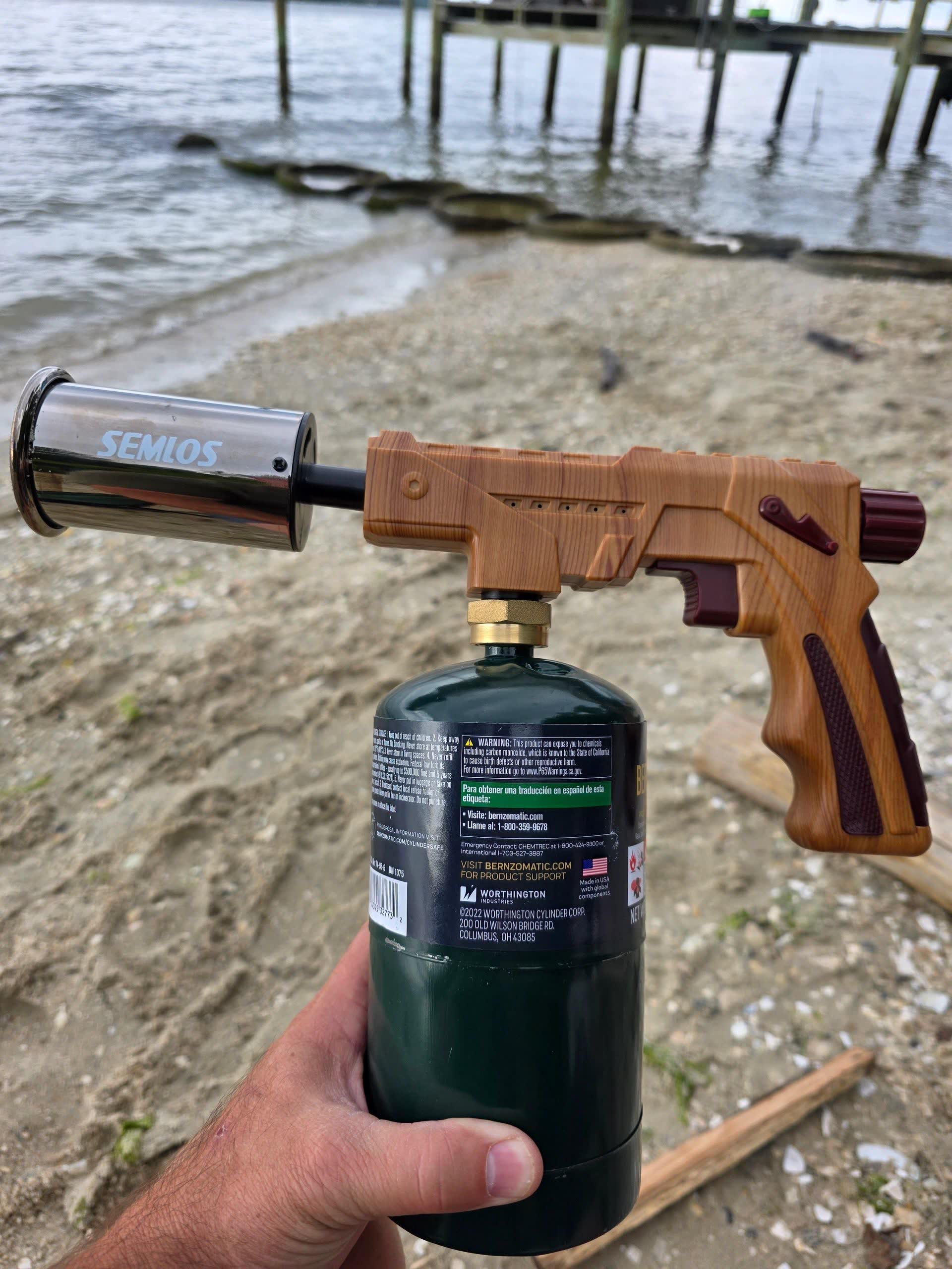 Semlos propane torch with a camping propane bottle attached