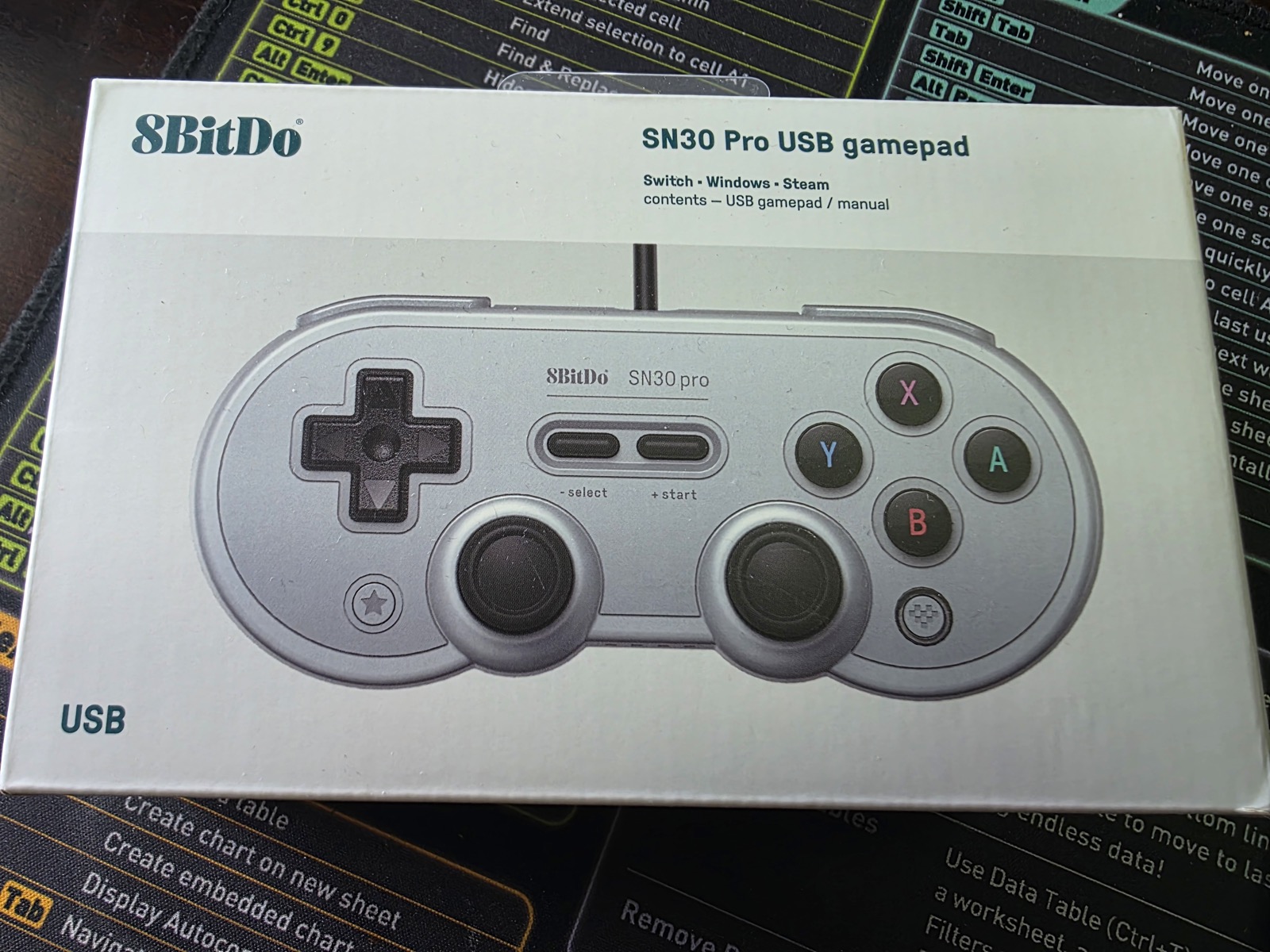 8BitDo SN30 Pro USB box on a desk mat
