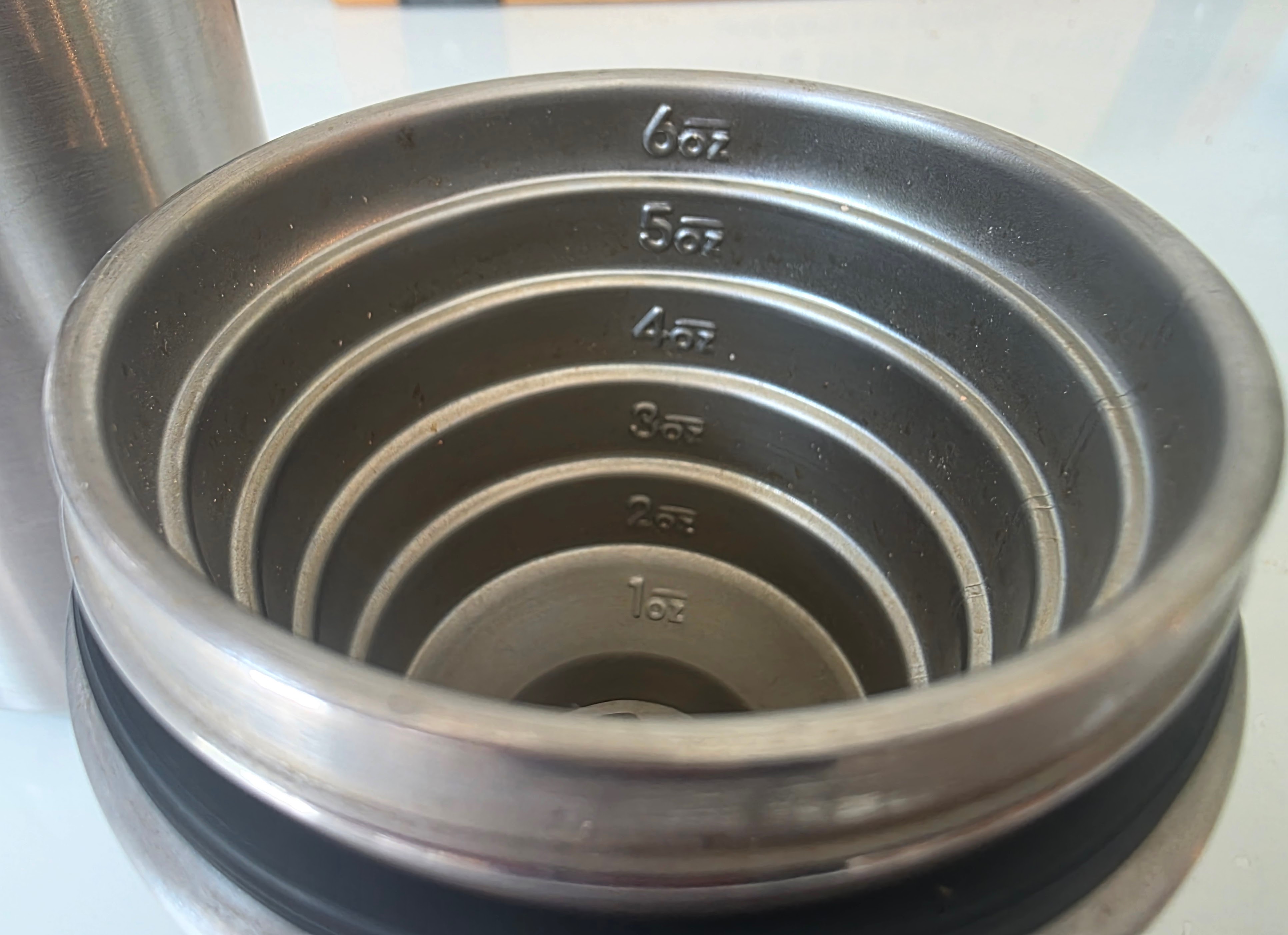 1 to 6 oz stepped measuring cap