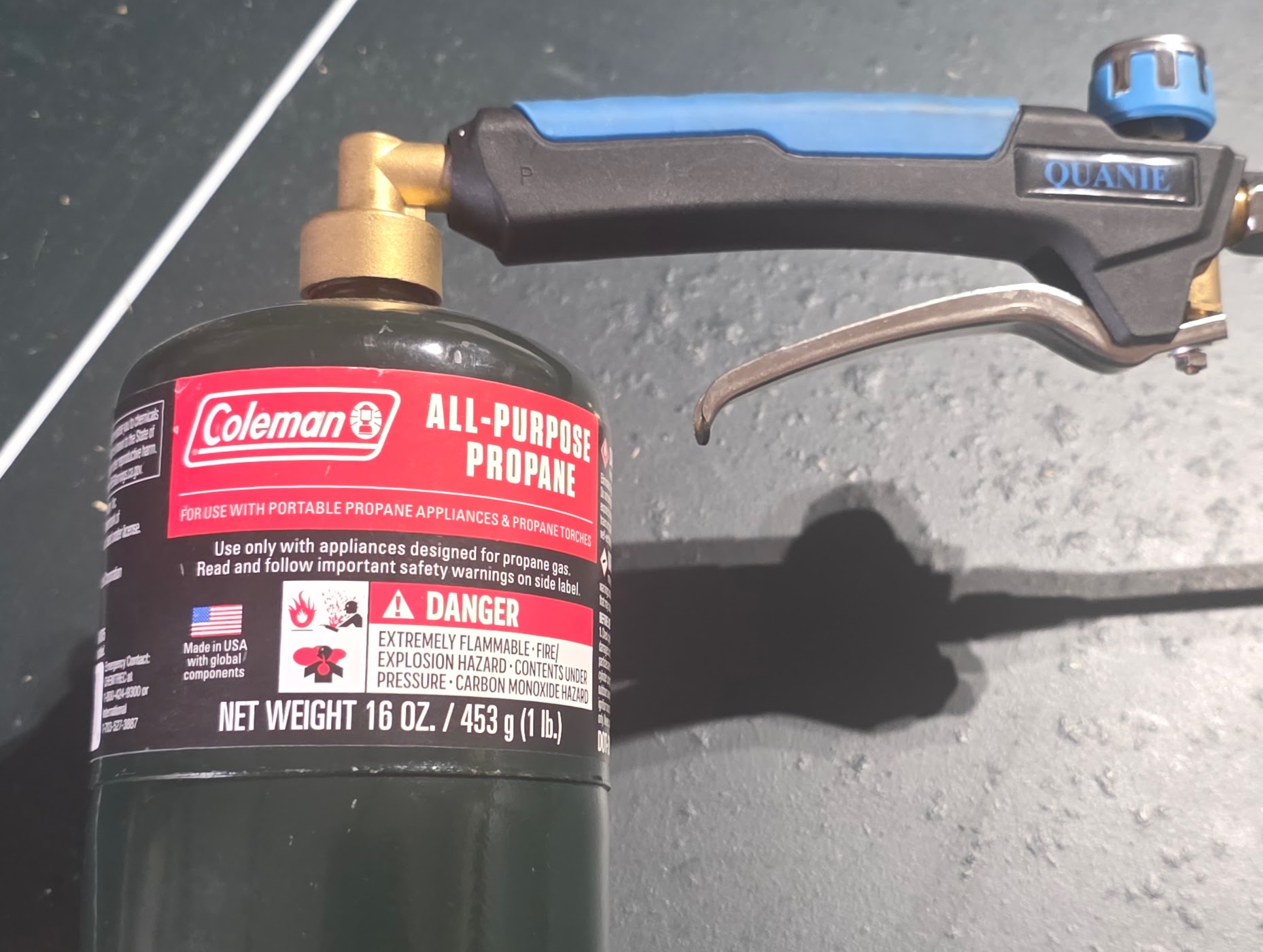 Quanie torch screwed onto Coleman 1lb propane cylinder