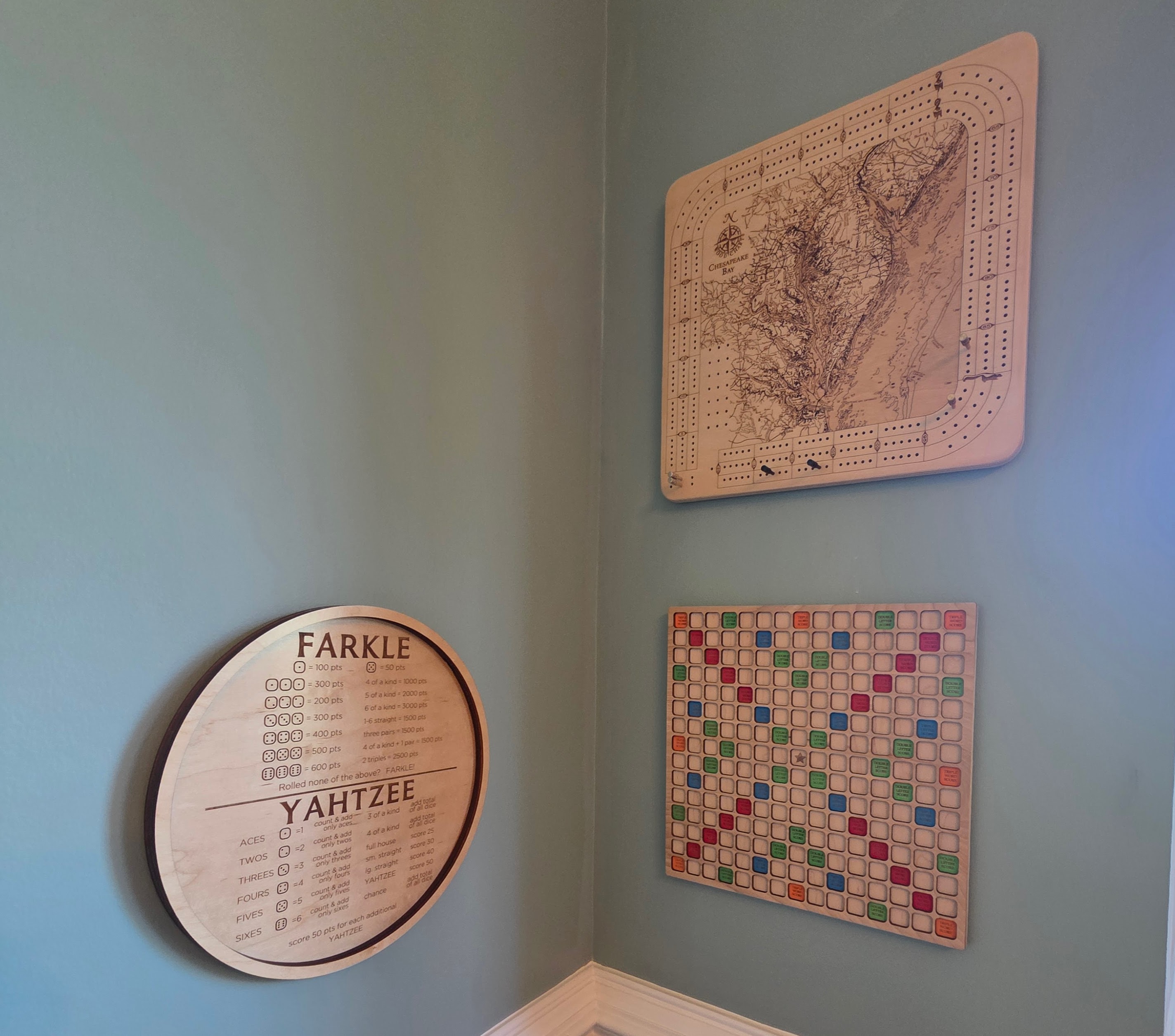 Cribbage, Scrabble, and dice game boards on the wall