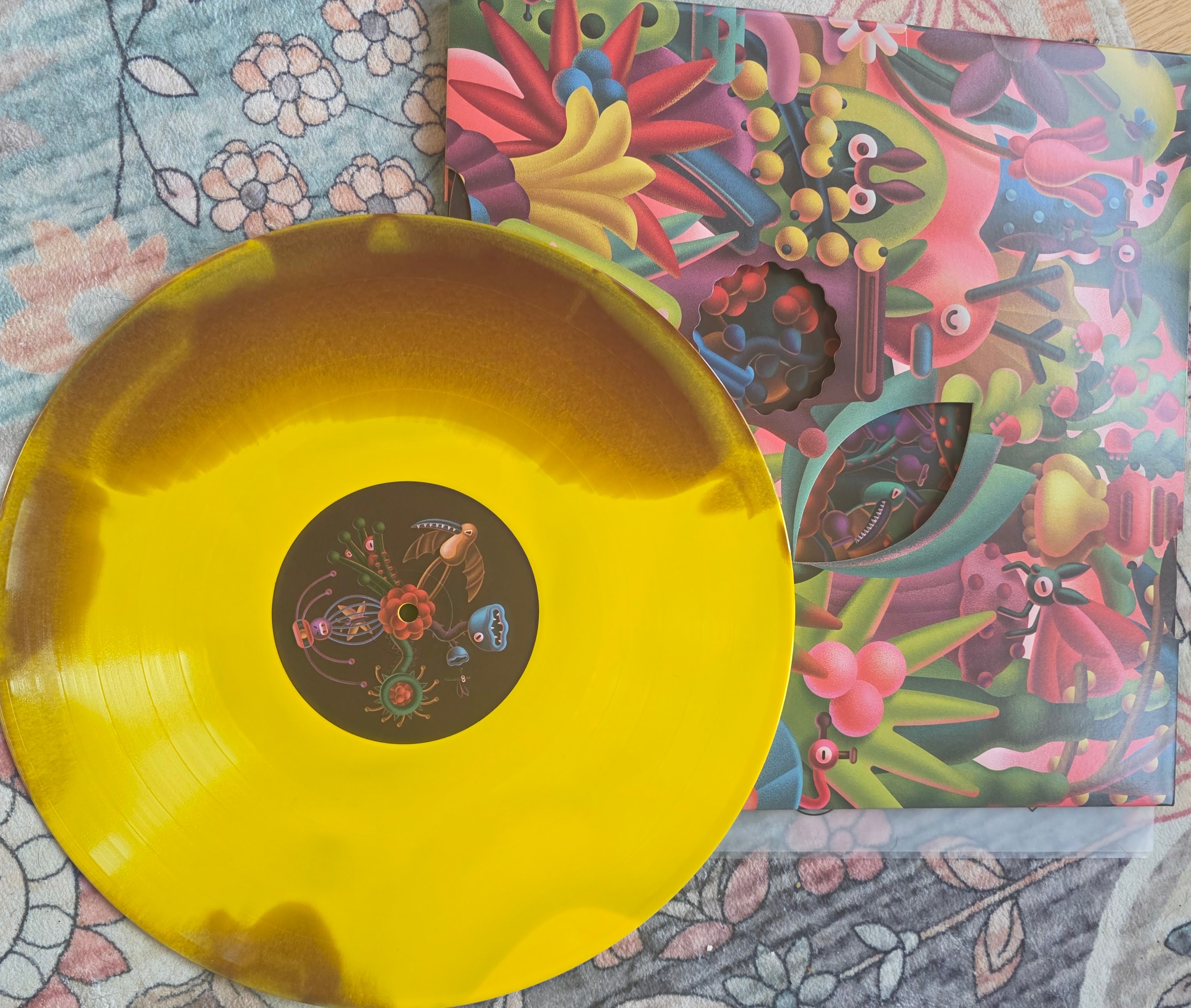 Yellow smoke-burst Vinyl Moon record with illustrated jacket