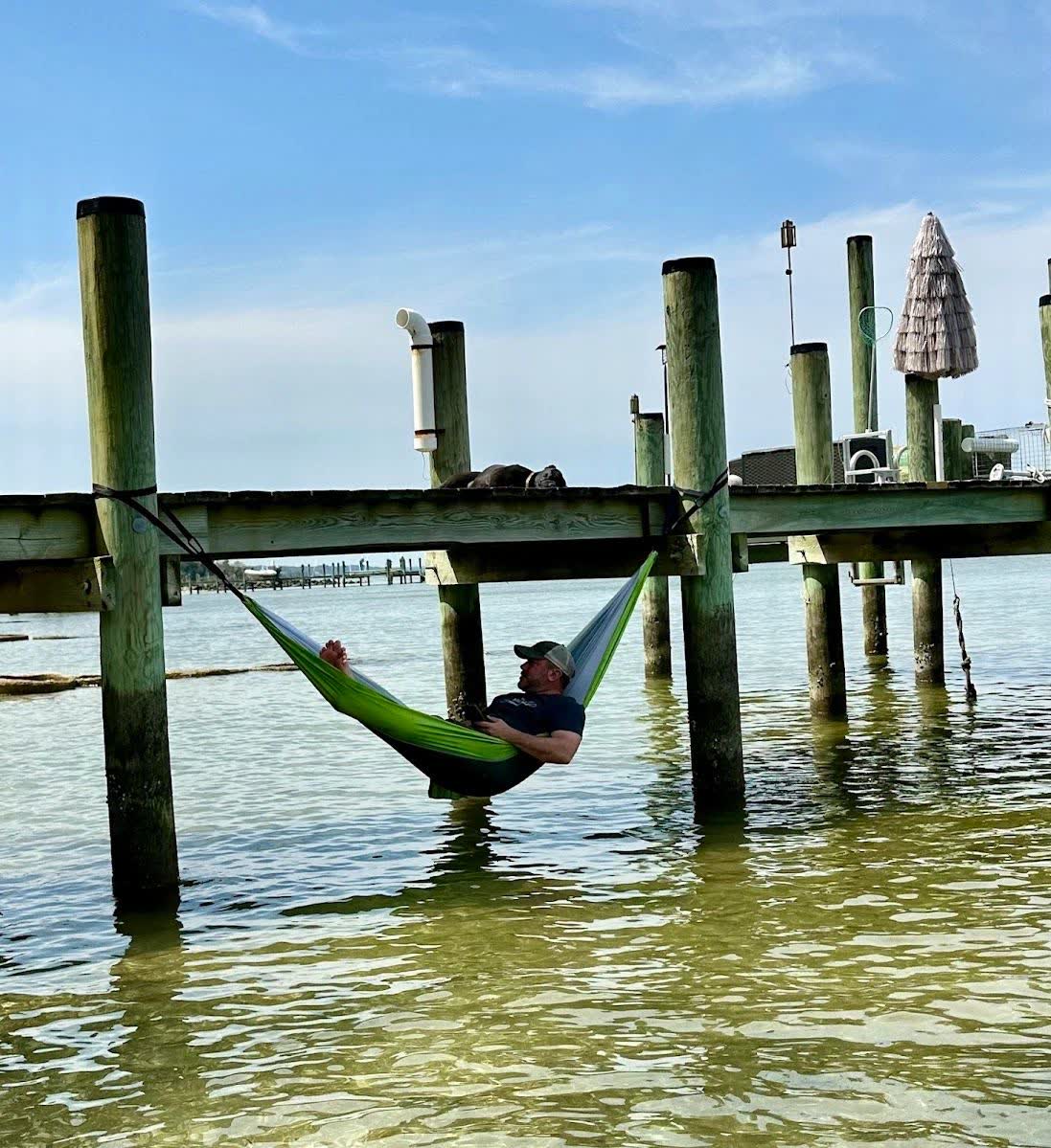 Camping hammock packed into its self-contained pouch